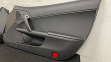 Load image into Gallery viewer, 05 13 Corvette C6 Driver Passenger Interior Door Trim Panels Black Pair OEM