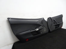 Load image into Gallery viewer, 05 13 Corvette C6 Driver Passenger Interior Door Trim Panels Black Pair OEM 56K