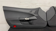 Load image into Gallery viewer, 05 13 Corvette C6 Driver Passenger Interior Door Trim Panels Black Pair OEM