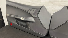 Load image into Gallery viewer, 05 13 Corvette C6 Driver Passenger Interior Door Trim Panels Black Pair OEM