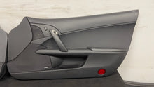 Load image into Gallery viewer, 05 13 Corvette C6 Driver Passenger Interior Door Trim Panels Black Pair OEM