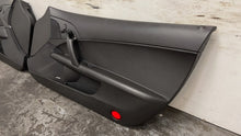Load image into Gallery viewer, 05 13 Corvette C6 Driver Passenger Interior Door Trim Panels Black Pair OEM