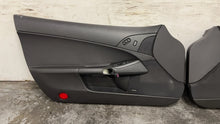 Load image into Gallery viewer, 05 13 Corvette C6 Driver Passenger Interior Door Trim Panels Black Pair OEM