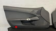 Load image into Gallery viewer, 05 13 Corvette C6 Z06 Driver Passenger Interior Door Trim Panels Black Pair
