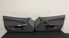 Load image into Gallery viewer, 05 13 Corvette C6 Driver Passenger Interior Door Trim Panels Black Pair OEM